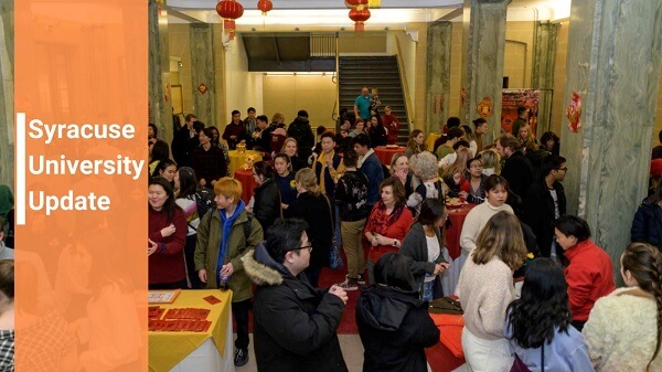 group of faculty, staff and students celebrating Chinese New Year with Syracuse University Update font