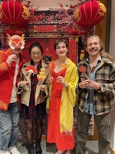 Syracuse staff pose for lunar new year celebration