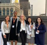Group of women with city scape in background