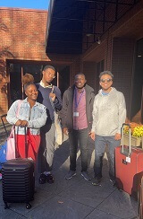 Picture with four students while attending the National Society for Black Physicists conference