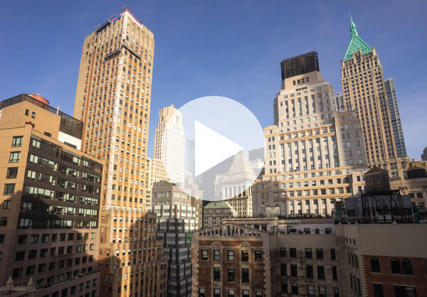 New York City skyline with play button.