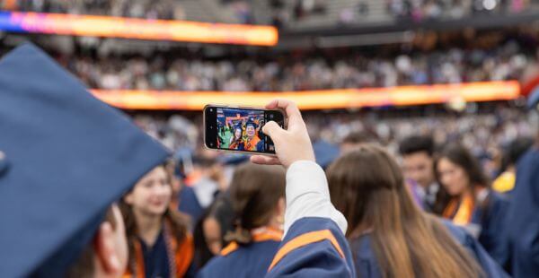 Graduating senior taking a selfie in the JMA Dome