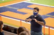Pruthvi Kilaru meets with staff and volunteers that he supervises at the University’s COVID-19 testing center at the stadium.