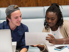 Two students studying together in Bird Library