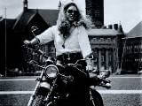 Sally Short on motorcycle.