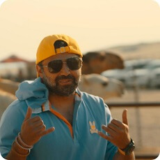Omar Maeena with a desert background