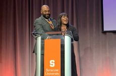 Roxi and Donovan McNabb on stage at Forever Orange Campaign Event