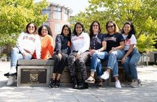 Women sitting on stone
