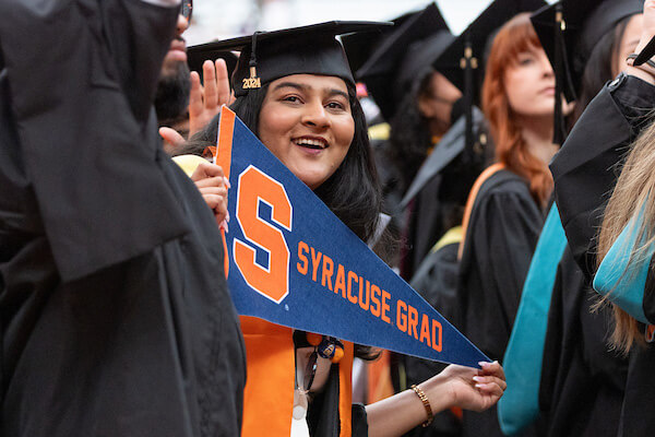 Graduate celebrates at Commencement ceremony.