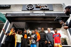 Tyree's Table Sign with family and friends