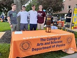 SPS leaders a staffing a table at SU Quad event