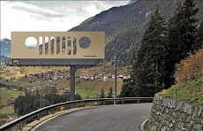 road with mountain, trees, and signage