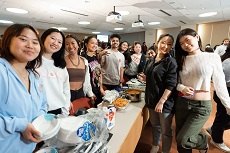 group of students standing with food