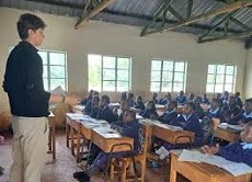 Syracuse student teaching in a class in Kenya