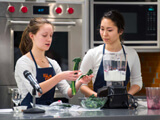 Students give a cooking demonstration in the Nutrition Education, Consultation and Education (ACE) Center.