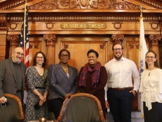 Panelists for Legislative Policy Day smile for a group photo in the Onondaga County Legislative Chambers at the Onondaga County Courthouse in downtown Syracuse, where the event was held.