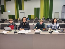 Syracuse University students sitting in in a forum. Shown from left to right, are Nathaniel Hasanaj, Iraklis Kapanidis, William Johnson and Grace "Gray" Reed.