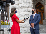 University College Dean Frascielloe Speaks to a reporter after a press event at City hall