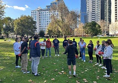Group of students having Rugby lessons in the park