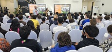 group of students listening in presentation about Syracuse University