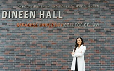 Shedid Omnia pose in front of Law School