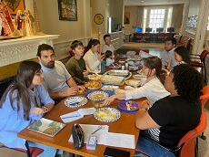 English conversation group session photo sitting and sharing food