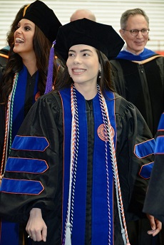 Ludmilla Evelin wearing graduation gown